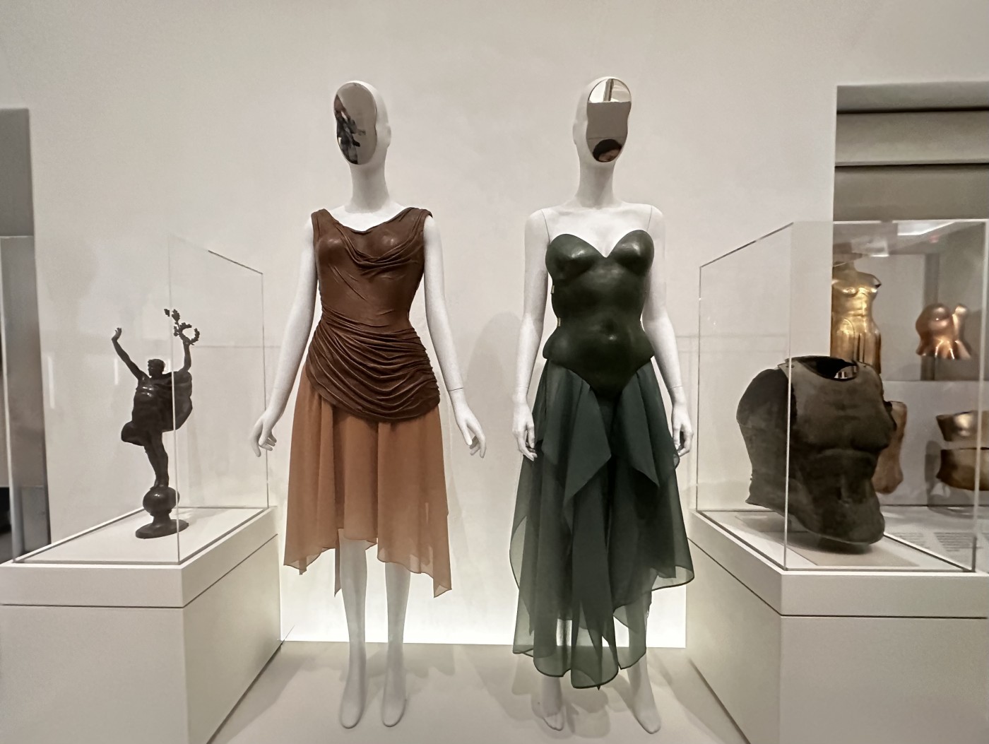 Vital Body: Vivienne Westwood (British) Mr. Pearl Martyr to Love jacket. Embroidered Silk Satin & Polychrome glass, crystals and clear pailettes, 1996-97 Man. Robert Wun (Hong Kong) Bleeding Coat 2024. Vital Body Diorama. Costume Art © Photo Jane Francis